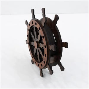May include: A dark brown wooden ship wheel coaster holder featuring a circular frame with eight protruding handles. The structure is composed of layered wood with a lighter brown outer ring and a darker inner core, designed to store circular coasters.
