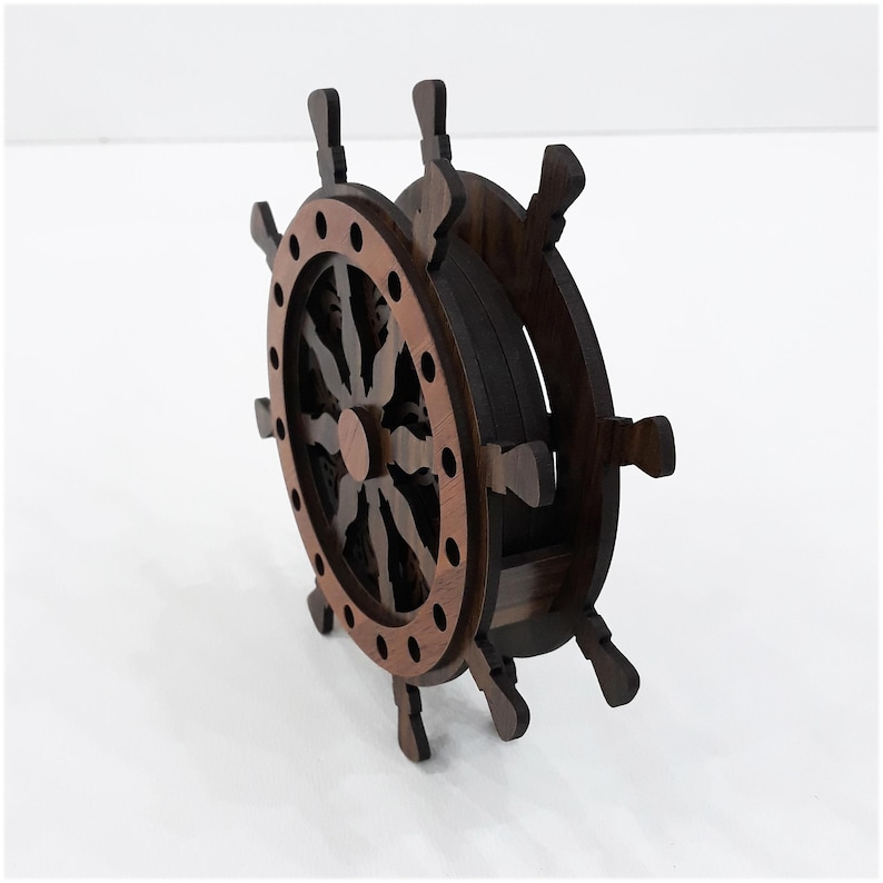 May include: A dark brown wooden ship wheel coaster holder featuring a circular frame with eight protruding handles. The structure is composed of layered wood with a lighter brown outer ring and a darker inner core, designed to store circular coasters.