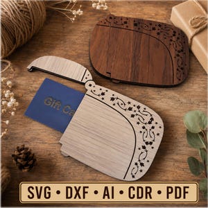 May include: Two wooden gift card holders with a curved edge and laser-cut floral and star patterns. One holder is light wood and contains a blue gift card with the text Gift Card visible. The second holder is dark wood and sits closed.