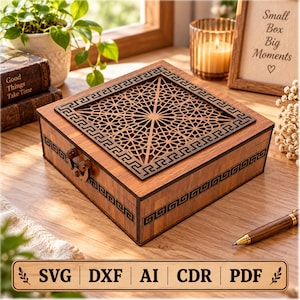May include: A square wooden box featuring a dark brown laser-cut geometric pattern on the lid and a Greek key border design along the sides. The box includes a metal latch closure on the front and displays a natural wood grain finish throughout.