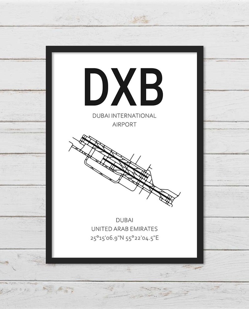 May include: Black and white illustration of Dubai International Airport (DXB) with the airport code and location details: Dubai, United Arab Emirates, 25&deg;15'06.9"N 55&deg;22'04.5"E.