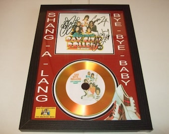 bay city rollers    signed  mount framed