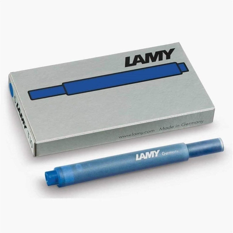 May include: A pack of blue ink cartridges for fountain pens. The pack is silver with the word "LAMY" printed in black. The cartridges are blue and have the word "LAMY" printed in white. The pack says "Made in Germany" and "www.lamy.com".
