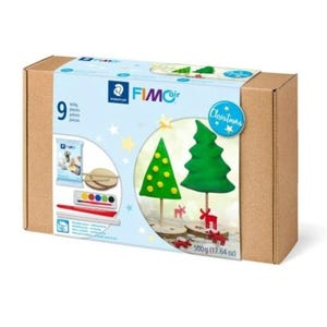 May include: A FIMOair Christmas craft kit in a brown cardboard box containing 9 pieces, including modelling clay, wooden bases, paint, and tools. The packaging features illustrations of green clay Christmas trees and red reindeer figures, weighing 500g.