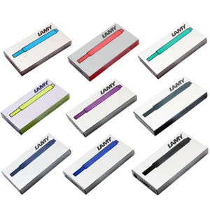 May include: Assortment of ten LAMY ink cartridges in various colors, including blue, red, green, yellow, purple, black, and dark blue. The cartridges are packaged in individual boxes with the LAMY logo.
