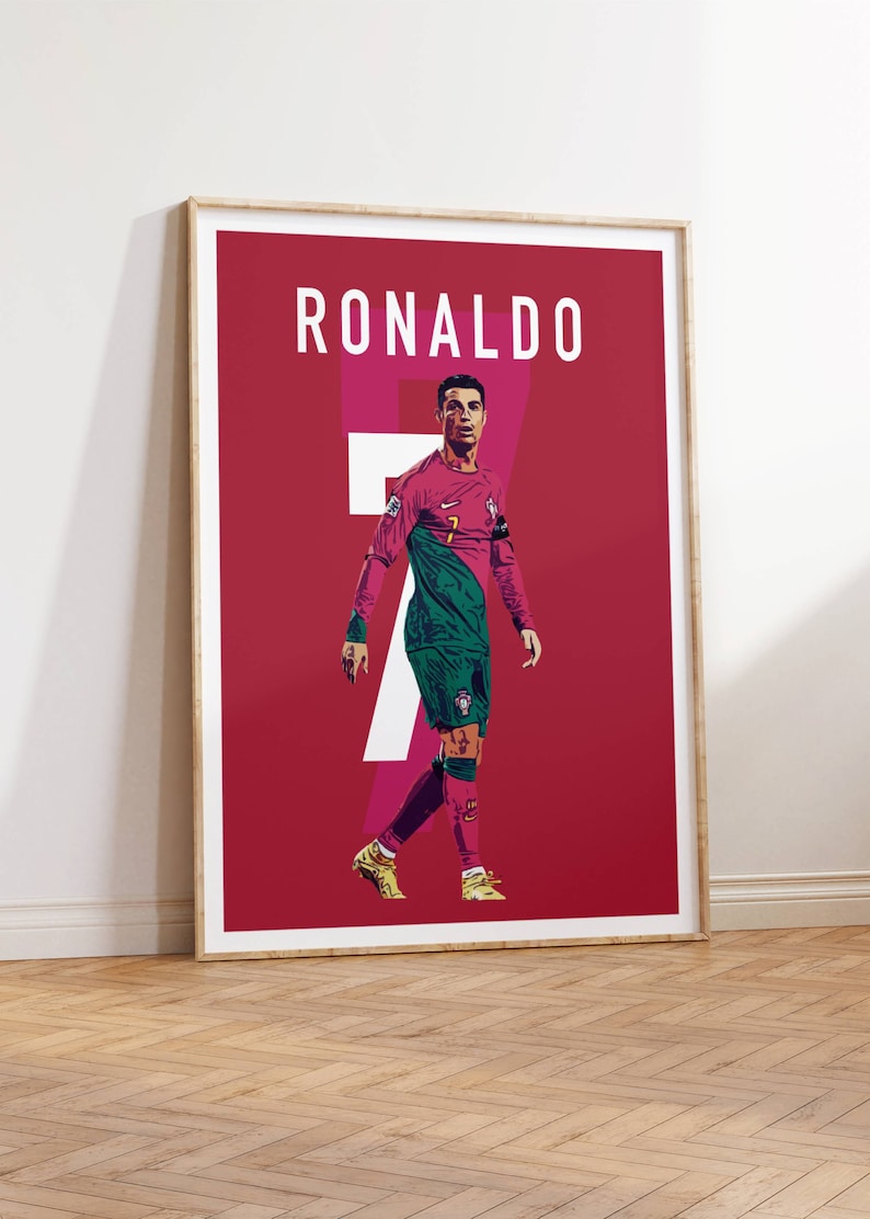 May include: A red poster with the word "RONALDO" in white text at the top. A soccer player wearing a pink and green jersey with the number "7" on the front is walking towards the right side of the poster.