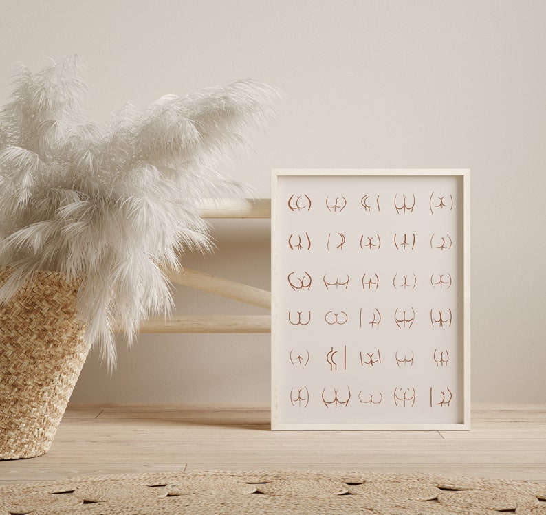 May include: A white framed print with a grid of brown symbols. The symbols are a combination of parentheses, brackets, and other geometric shapes.