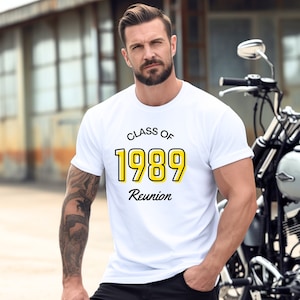 May include: White t-shirt with black text that reads "Class of 1989 Reunion". The year 1989 is in yellow with a black outline.