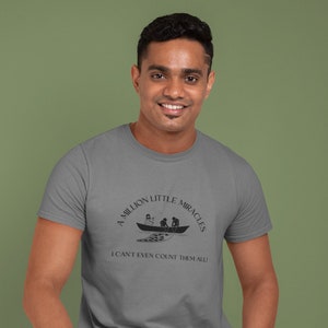 A Million Little Miracles Unisex Heavy Cotton Tee Shirt