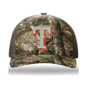May include: A brown and green camouflage baseball cap with a gray "T" embroidered on the front. The "T" has a red outline. The cap has a black mesh back and a black brim.
