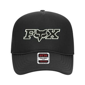 May include: Black trucker hat with a white Fox logo and the text "OTTO WORLD FAMOUS FOAM FRONT CAP" on a white label.