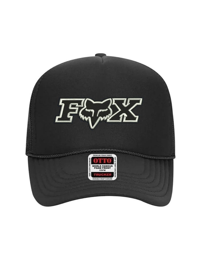 May include: Black trucker hat with a white Fox logo and the text "OTTO WORLD FAMOUS FOAM FRONT CAP" on a white label.