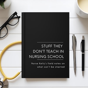 May include: A black notebook with the text "STUFF THEY DON'T TEACH IN NURSING SCHOOL" sits on a white surface. A yellow stethoscope, black glasses, and two pens are also on the surface. A cup of coffee and a small plant are also visible.