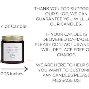 A 4 ounce candle in a clear glass jar with a gold lid. The candle is labelled "Smells like a baddie just graduated". The candle is 2.75 inches tall and 2.25 inches wide.