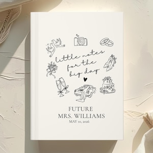 May include: A white wedding journal with black line art illustrations of wedding-related icons, including doves, a camera, rings, flowers, champagne flutes, a car, a cake, and shoes. The text reads "little notes for the big day" and "FUTURE MRS. WILLIAMS MAY 10, 2026."