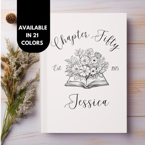 May include: A white book cover with black text and illustrations. The text reads "Chapter Fifty Est 1975 Jessica". The illustration is of an open book with flowers on top.