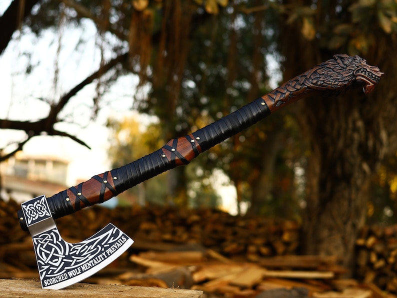 Wolf engraved axe