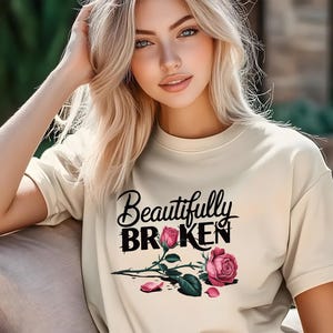 Beautifully Broken Rose T-Shirt – Inspirational Graphic Tee for Women – Resilience Quote Shirt – Soft Beige Comfort Tee