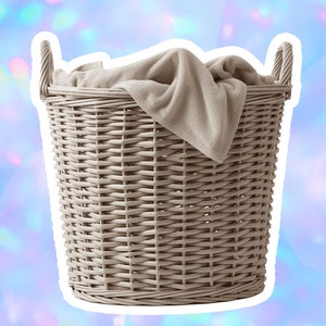 May include: A light brown wicker laundry basket with a beige blanket inside.