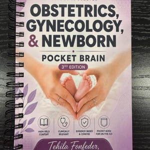 May include: A spiral-bound book titled Obstetrics, Gynecology, & Newborn Pocket Brain 3rd Edition by Tehila Fonfeder, CNM, ARNP, MSN. The cover features a purple and white gradient with an illustration of hands forming a heart around baby feet.