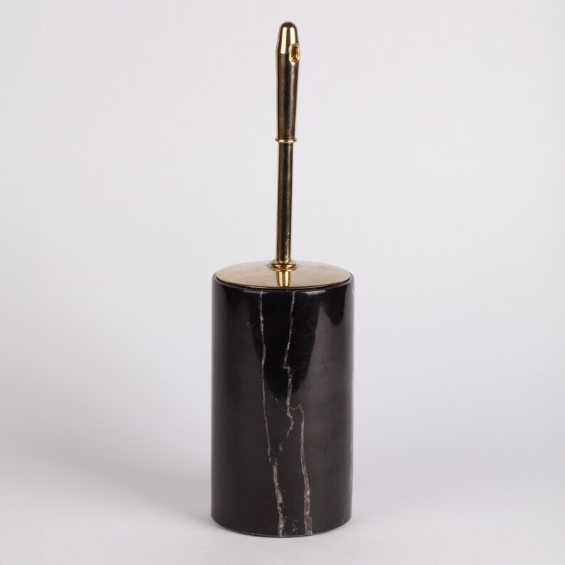 May include: Black marble toilet brush holder with a gold metal handle.