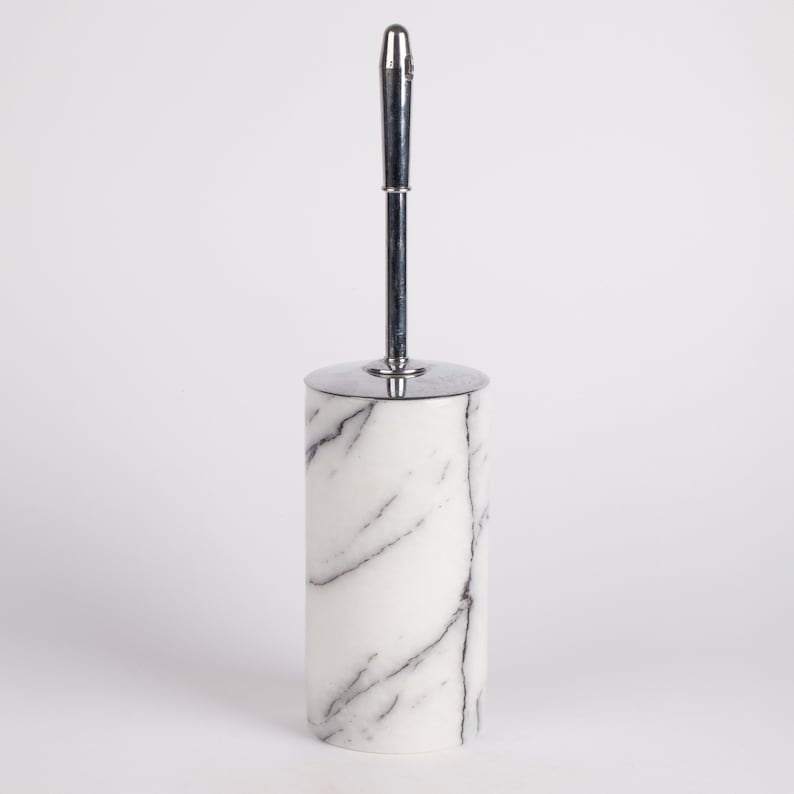 May include: White marble toilet brush holder with a chrome handle.