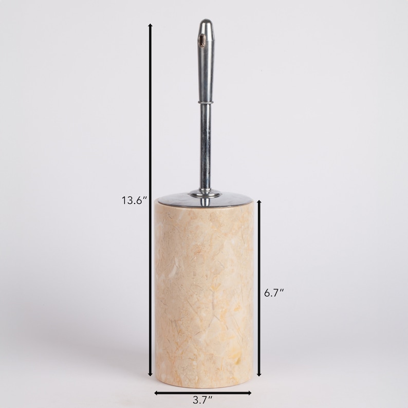 May include: A beige marble toilet brush holder with a chrome handle. The holder is 13.6 inches tall, 6.7 inches wide, and 3.7 inches in diameter.