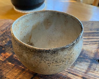 wood-fired stoneware pottery bowl with carbon trap shino glaze