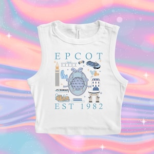 Pode incluir: Top branco sem mangas com um design gráfico azul e branco que apresenta o texto "EPCOT EST 1982" e várias ilustrações de atrações e marcos do parque temático.