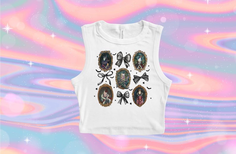 May include: White sleeveless crop top with a print of eight framed portraits of various characters with black bows and bats. The portraits are in gold frames with ornate details.