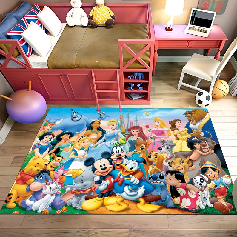 May include: A colorful rug with a blue background featuring Disney characters including Mickey Mouse, Minnie Mouse, Donald Duck, Goofy, and various princesses. The rug is in a room with a pink bunk bed and a desk with a laptop.