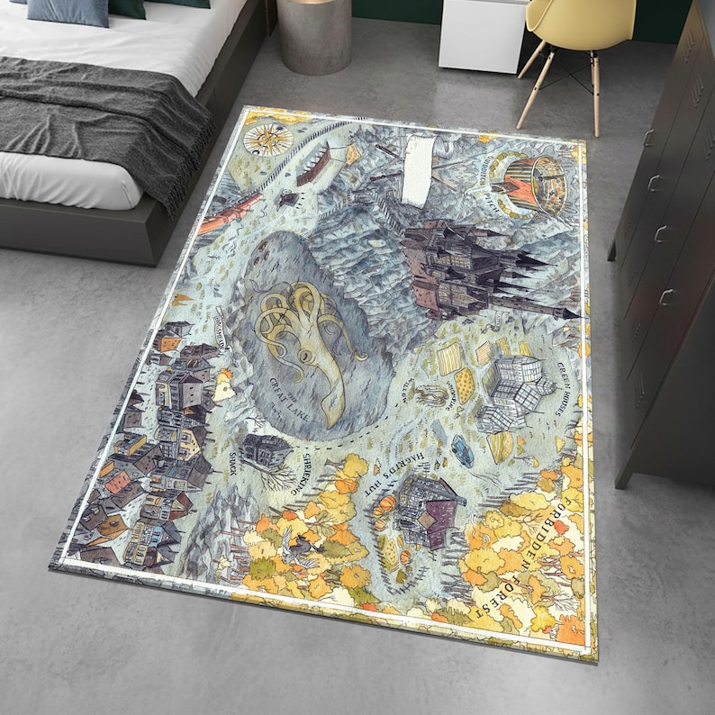 May include: Rectangular area rug with a fantasy map design. The rug features a detailed illustration of a fictional landscape with a lake, buildings, and a forest. The color palette includes blues, greens, yellows, and browns, with a white border.