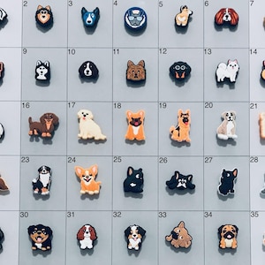 May include: A set of 35 colorful dog shoe charms, each featuring a different breed of dog. The charms are made of rubber and have a variety of colors and designs.