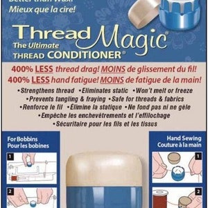 May include: A blue and white container of Thread Magic, a thread conditioner. The container is labeled "Thread Magic" and "The Ultimate Thread Conditioner". The product claims to reduce thread drag and hand fatigue by 400%. The container is shown being used on a bobbin and for hand sewing.