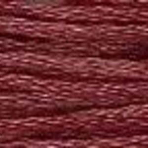 May include: Close-up of a deep burgundy textured fabric with a woven pattern.