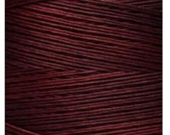 May include: A spool of deep red embroidery thread.