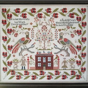 May include: Framed cross-stitch sampler with a detailed design. The artwork features a central house, birds, and figures, surrounded by floral and foliate borders. Text includes the names "Rachel Howells" and "David and Mary", and the phrase "Aged 18 years".