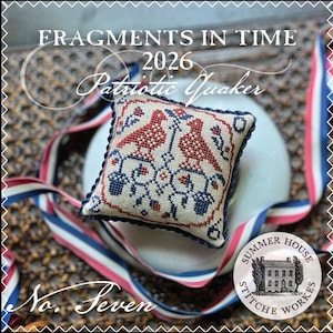 May include: A square cross-stitch pincushion featuring a red and blue bird motif on a beige fabric background, bordered with dark blue twisted cord. The text reads FRAGMENTS IN TIME 2026 Patriotic Quaker No. Seven and Summer House Stitche Workes.