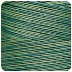 May include: Close-up of a spool of green and teal thread. The thread is tightly wound, with visible diagonal lines of color variation. The thread appears to be made of a natural fiber.