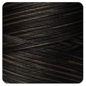 May include: Close-up of a spool of black and gray thread.