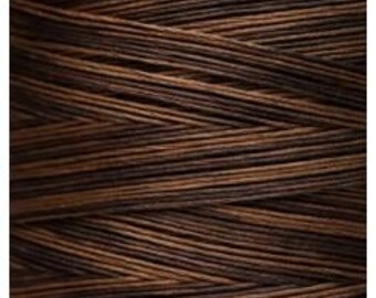 May include: A spool of brown and black waxed linen thread.