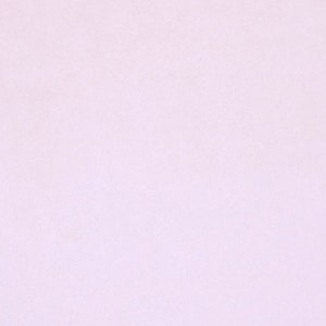 May include: A solid, light purple background.