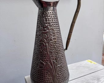 Brass silver plated pitcher with hammered details and chrome finish
