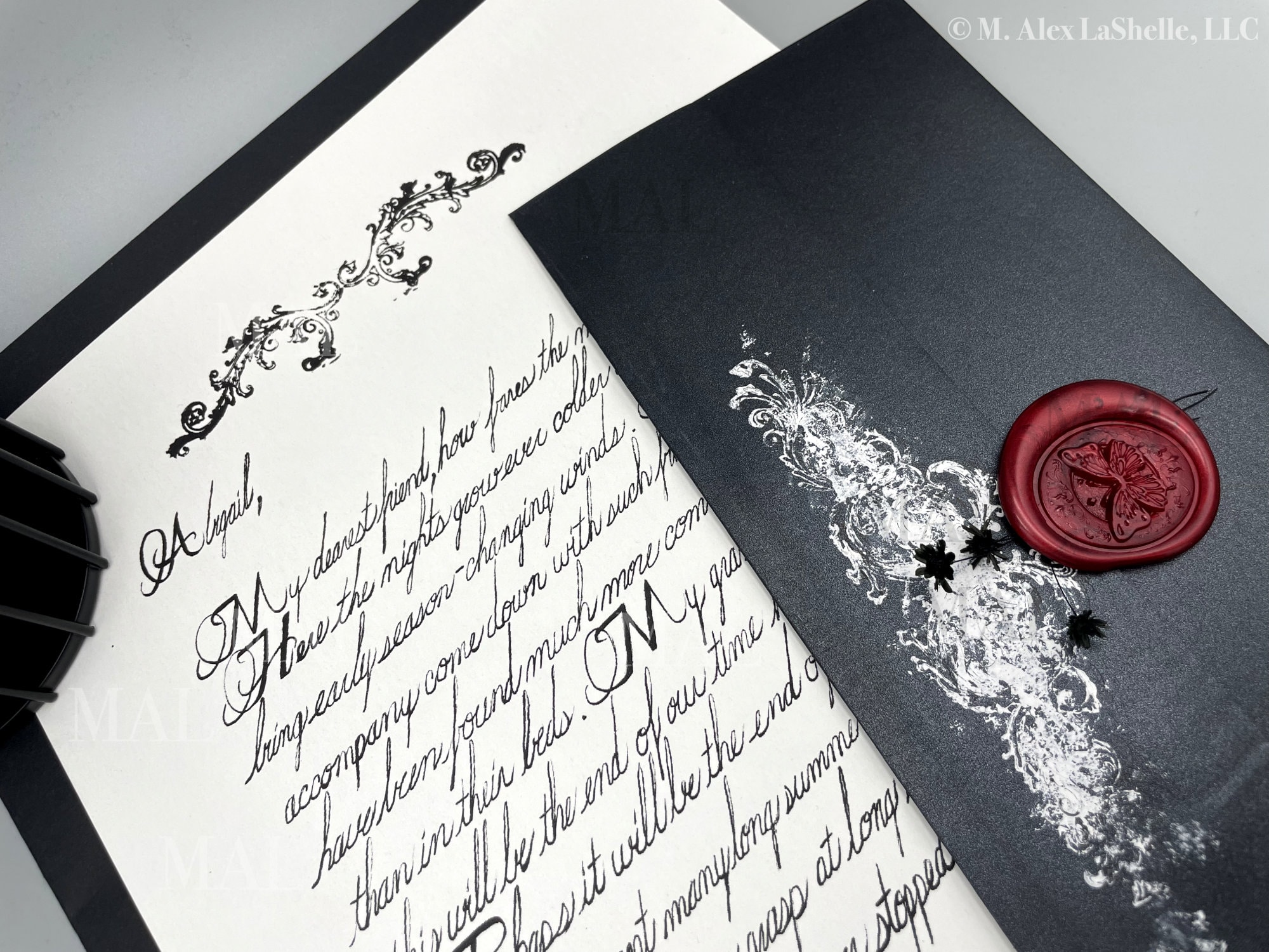 handwritten-letter-service-flutters-in-darkness-butterfly-seal-black