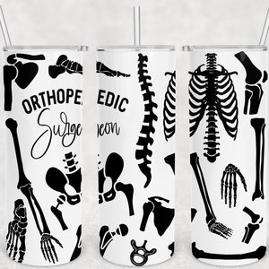 May include: Three white tumblers with black skeletal designs and text. The tumblers feature different skeletal designs, including a rib cage, a spine, and various bones. The text on the tumblers reads "Orthopedic Surgeon" and "EDIC Neon".