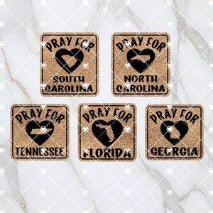 May include: Six brown square signs with the text "Pray For" and the outline of a state in a heart shape. The states are South Carolina, North Carolina, Tennessee, Florida, and Georgia.
