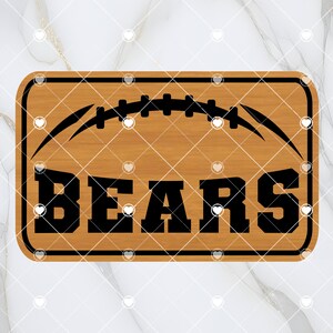 May include: A wooden sign with a brown background and black text. The sign features a football graphic and the word "BEARS".