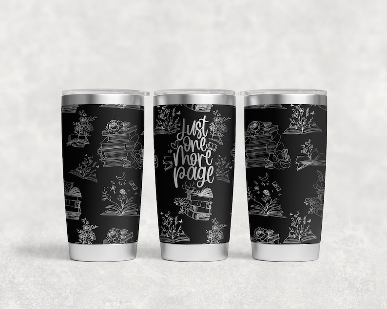 May include: Three stainless steel tumblers with a black background and white design. The design features a stack of books, flowers, and the text "Just One More Page".