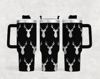 May include: A black stainless steel travel mug with a silver deer head pattern and a black handle. The mug has a lid with a straw.