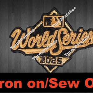 May include: Embroidered patch with the words "World Series" in gold script, with the year "2023" below. The patch is black with gold accents and a baseball diamond logo. The text "Iron on/Sew On" is at the bottom.